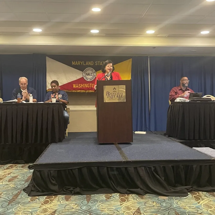 President Edwards speaks with union workers at the MD & DC Council of the National Association of Letter Carriers.